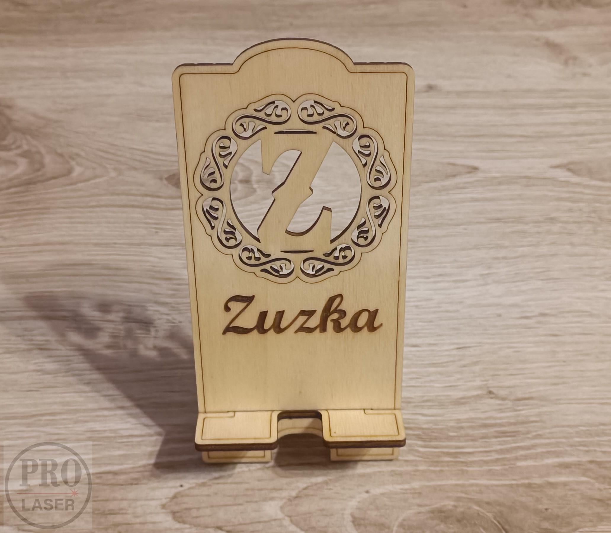 Stojánek na telefon s písmenem